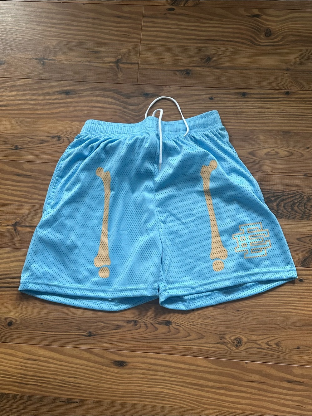 Eric Emanuel Light Blue Mesh Shorts with Yellow Bone Graphics